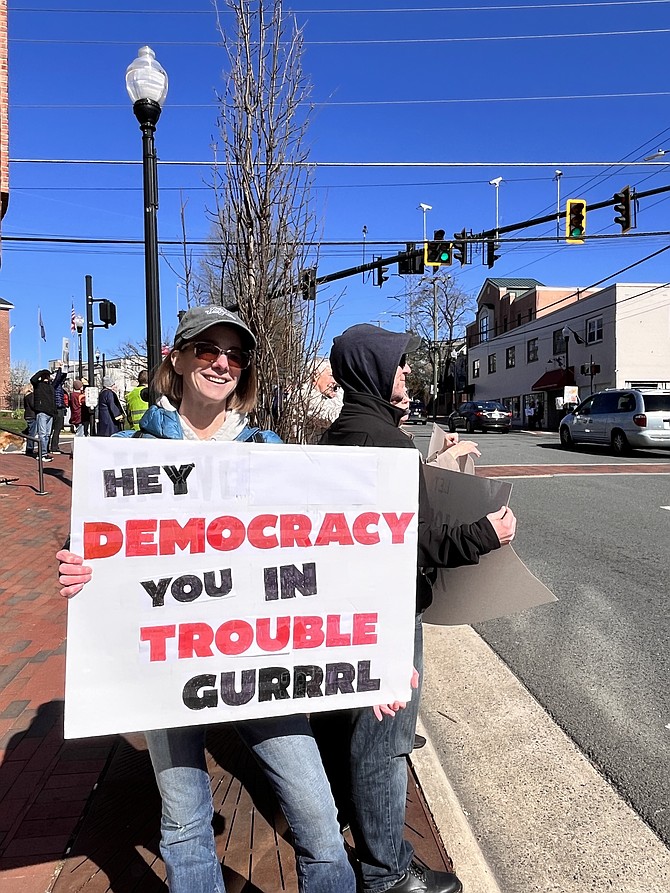 Lara Bury, of Springfield, attends the No Kings protest in the Town of Herndon, Saturday, March 28. Bury says the protests are building community and helping people feel less alone.