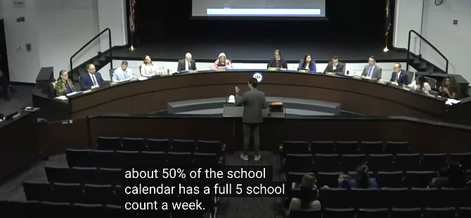 Anthony Lampkin speaks on behalf of his two children at Wolf Trap Elementary during the April 9 Fairfax County School Board meeting.