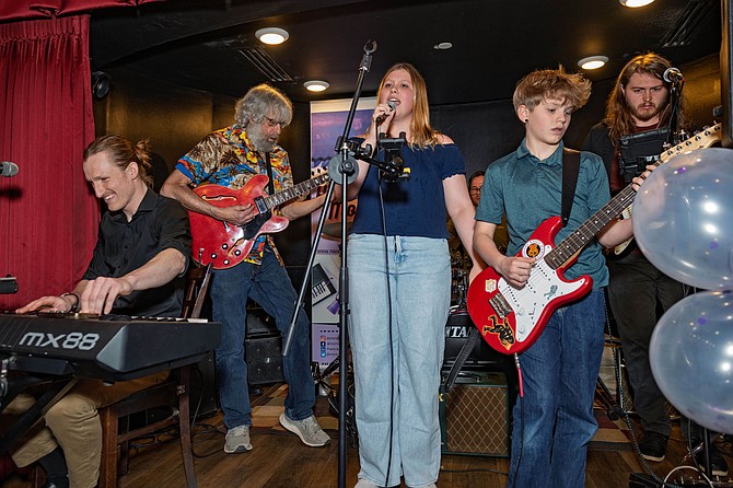 Piano & More students performing with live band at 10-year celebration