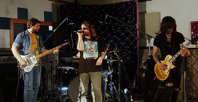 Singer Ean Eschenburg with guitarist Andrei Wells, Bass player Will Gies and drummer Eric Levy.