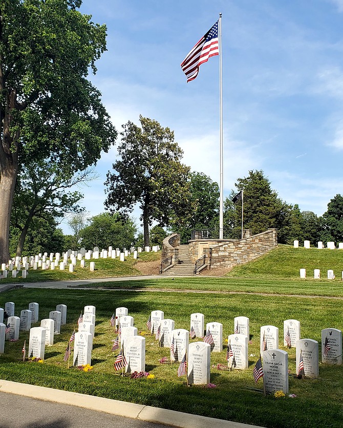 U.S. Flags adorn the graves of more than 4,000 fallen veterans at Alexandria National Cemetery on Memorial Day 2024.