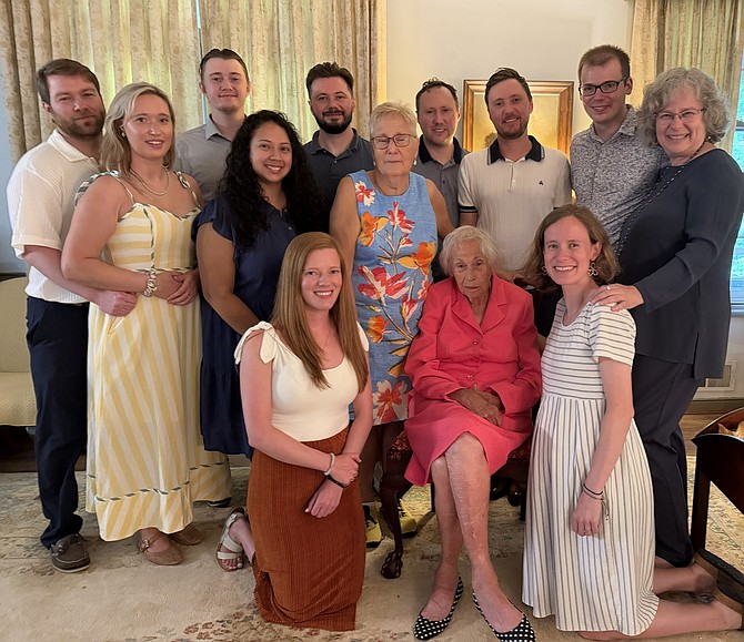 Margaret Johnson, seated, celebrates her 100th birthday surrounded by family members at her home in Alexandria. Johnson was born June 30, 1926.