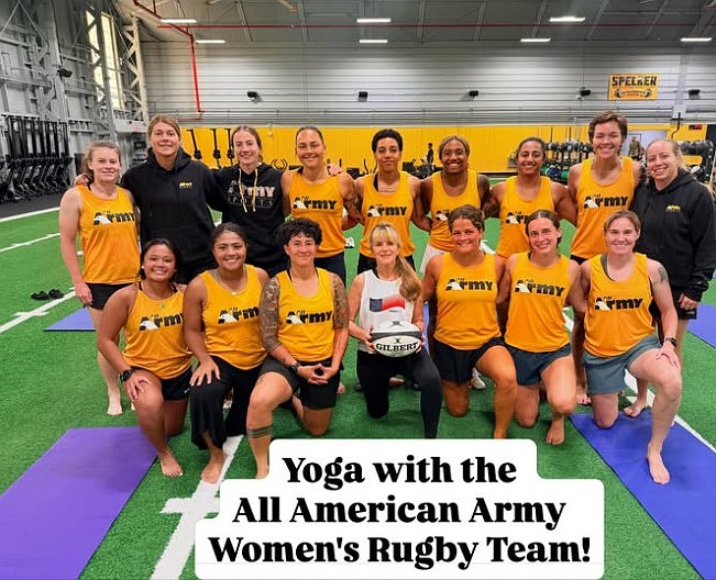 Yoga instructor Melanie Latrash, center, surrounded by the Army Women's Rugby Team at Fort Belvoir.