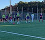 Athletes and volunteer buddies run through drills during …