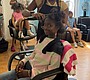 Khadija Yahya gets a haircut from stylist Nickie …